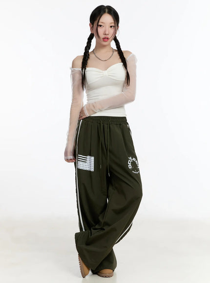 graphic-wide-leg-track-pants-cm511