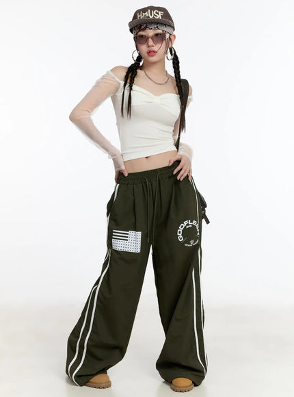 graphic-wide-leg-track-pants-cm511