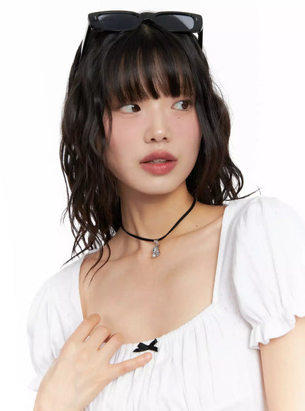 acc-onkapo-teddy-with-a-ball-black-cord-necklace-cg507