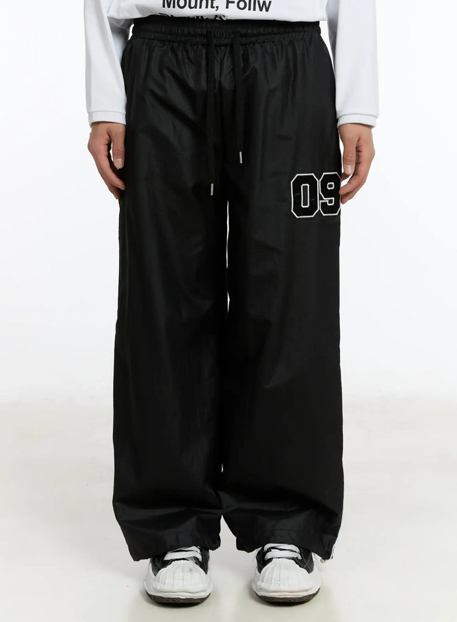 mens-09-graphic-nylon-drawstring-pants-im503 / Black