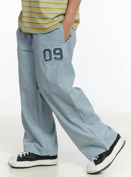 mens-09-graphic-nylon-drawstring-pants-im503