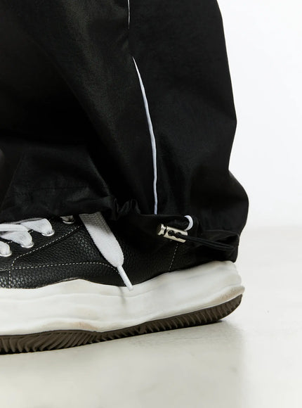 mens-09-graphic-nylon-drawstring-pants-im503