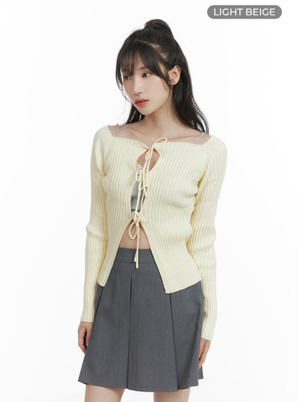 ribbon-tie-cut-out-cardigan-ca403 / Light beige